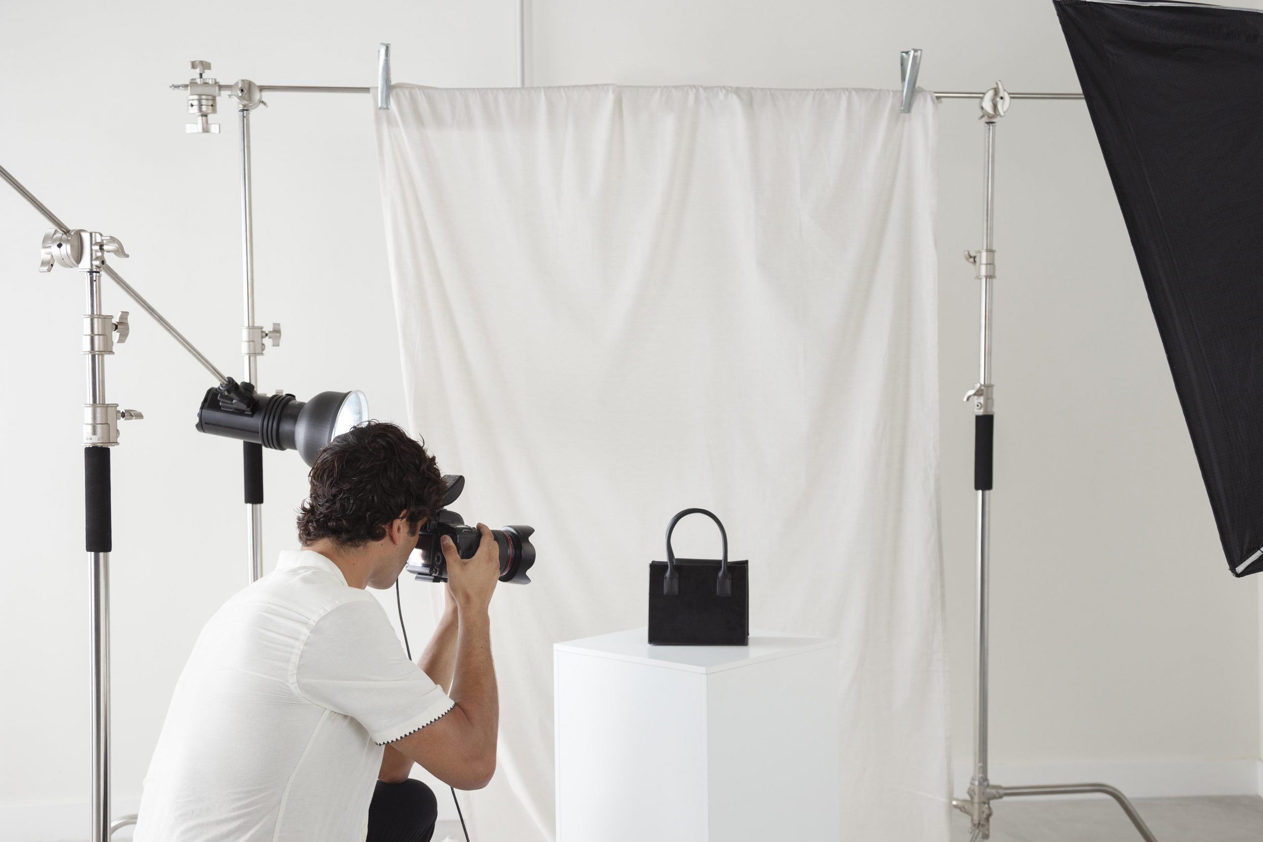 young man working his photography studio scaled 1